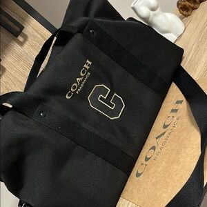 Coach Black Duffel Bag with Gold Accents